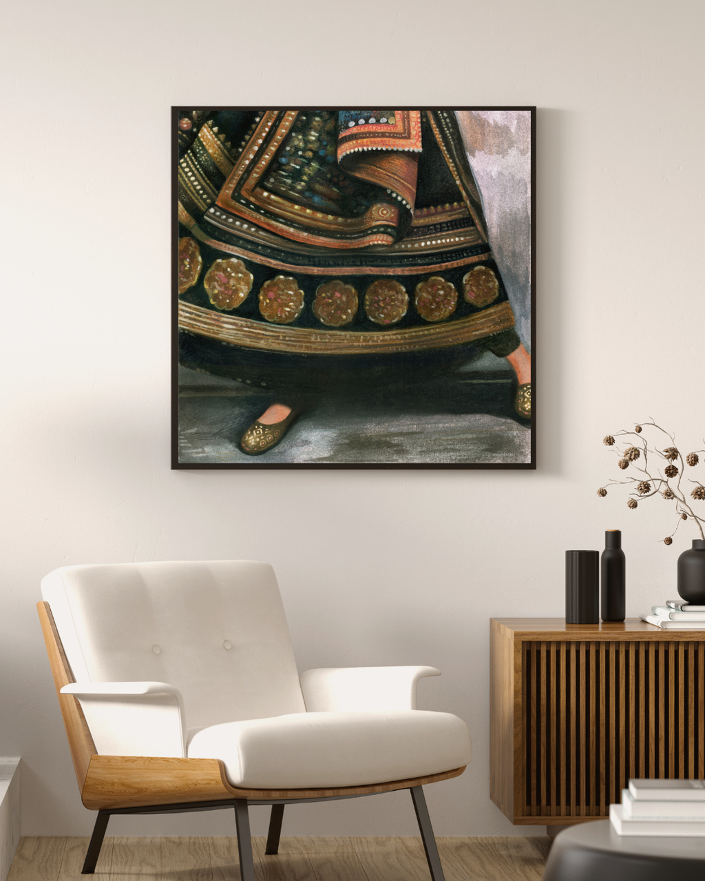 Framed artwork on a wall above a modern chair in a living room setting.