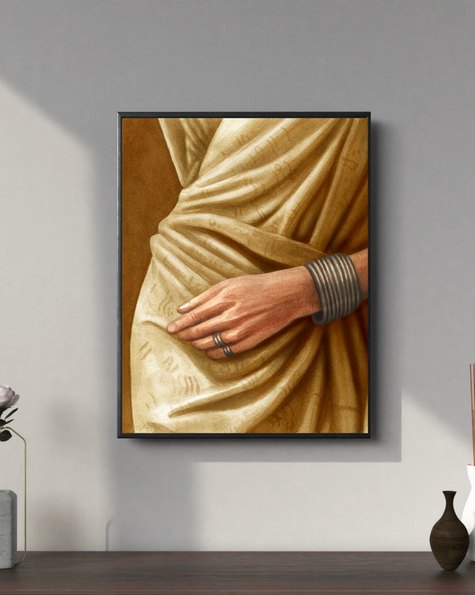 Framed artwork of a hand with a ring on a wall above a wooden shelf.